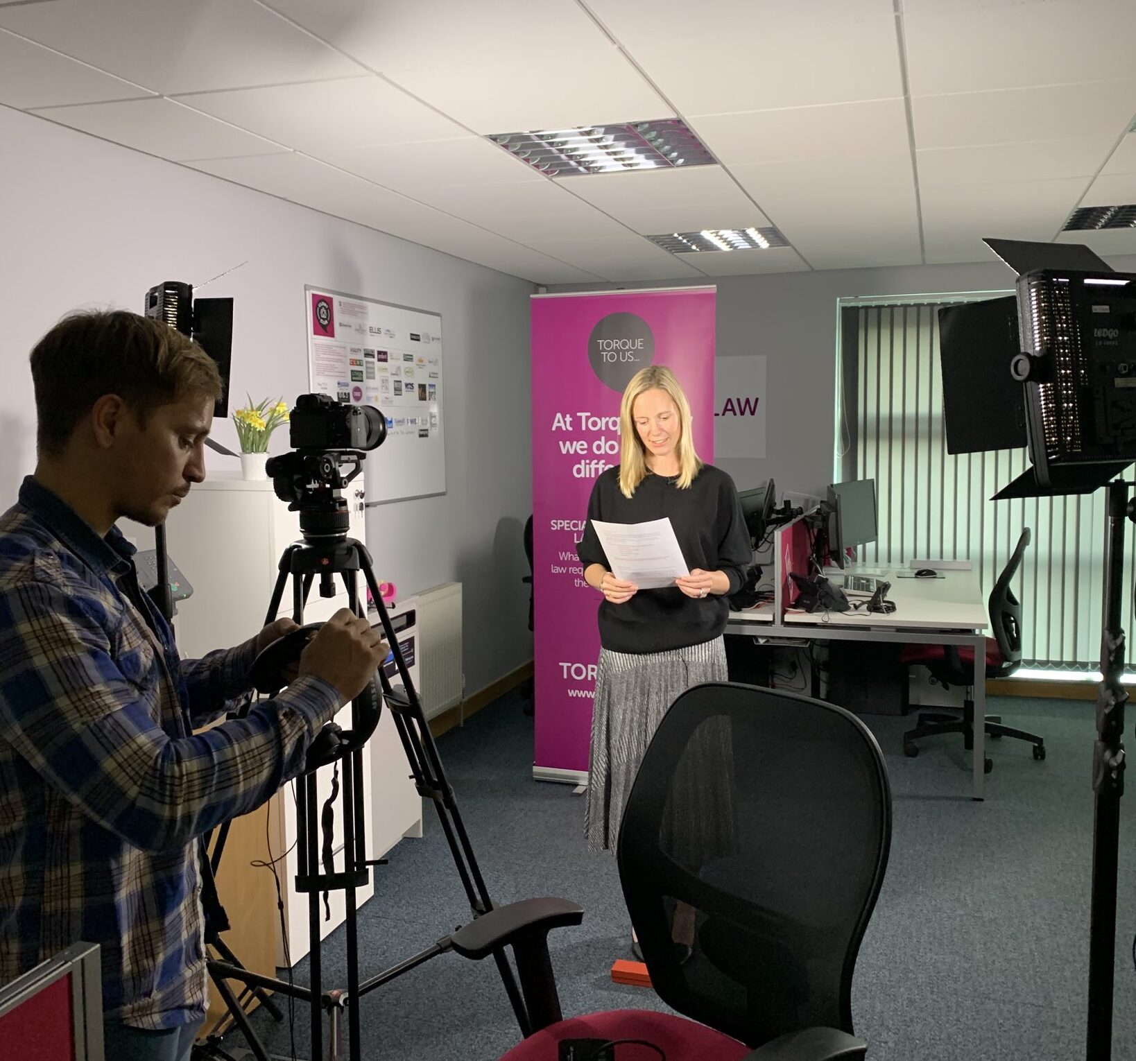 Emma in front of a camera crew